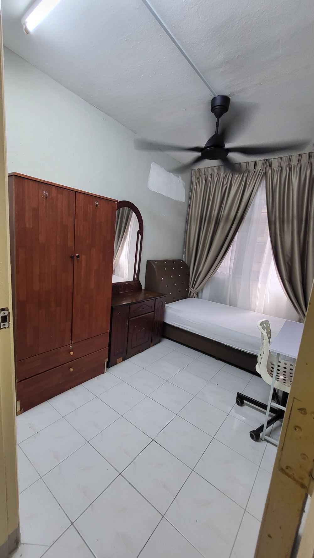 Bedroom with ceiling fan and wardrobe